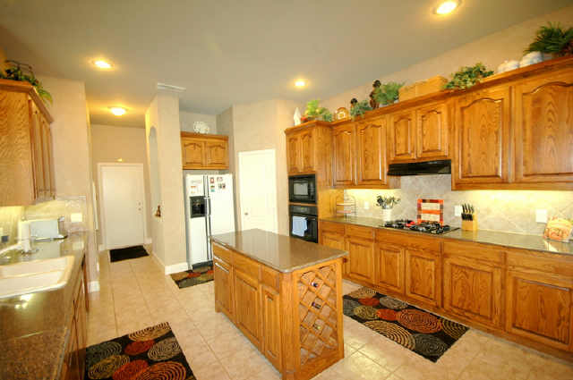 Large kitchen with island and an abundance of cabinets and counter space.