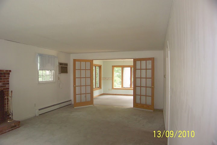 Living room opening to sunroom