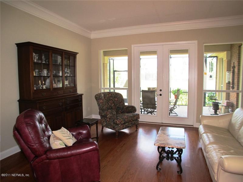 French Doors open to Lanai for gracious entertaining. Crown Molding and Hardwood floors highlight this Formal Room.