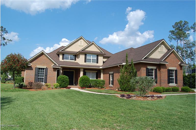 Magnificent Toll Brothers brick home on Estate lot in beautiful Cypress Creek in Eagle Harbor