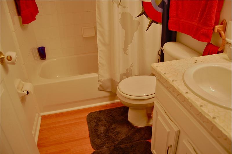 Custom Mirror, Countertop and Laminate flooring in this upgraded home