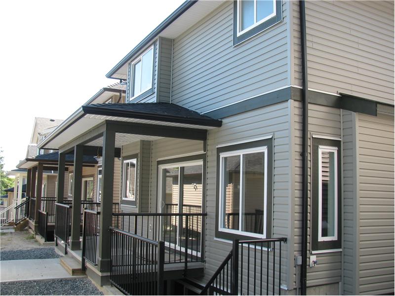 Exterior back with stairs to the basement