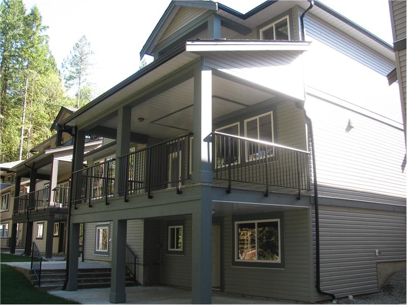 Exterior Rear of the home showing the 3 levels and the balcony off the Master Bedroom
