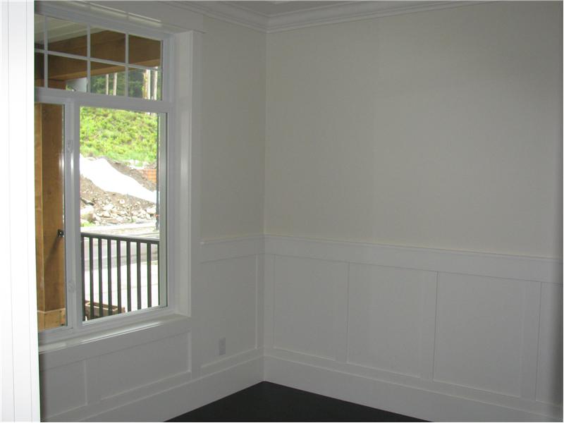 Den off the entrance with wainscoting