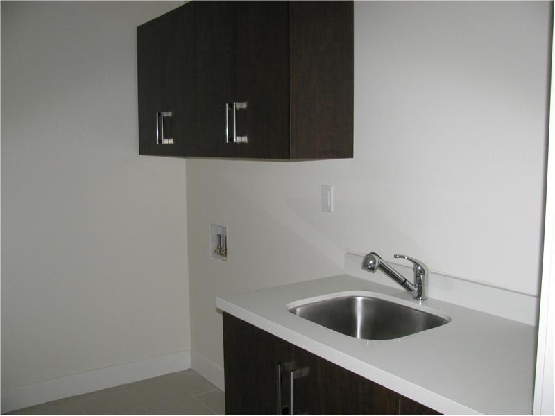 Laundry Room with counter cabinet, sink and cupboard for laundry soap