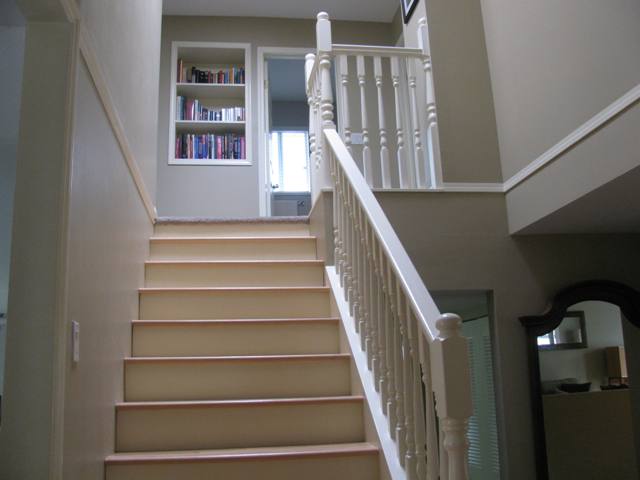 Stairs to the above floor with solid beech hardwood floors