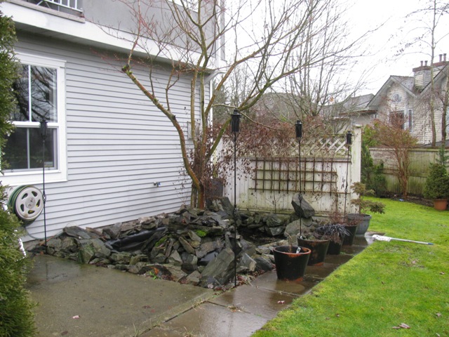 Exterior showing patio and fish pond