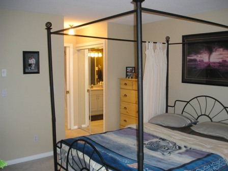 Master bedroom showing access to the bathroom