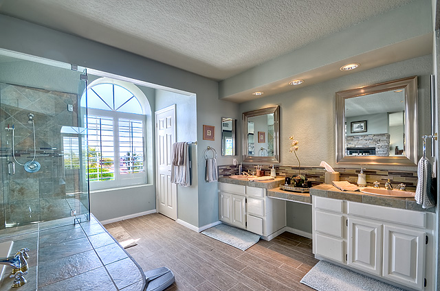 Dual vanities; glass enclosed shower